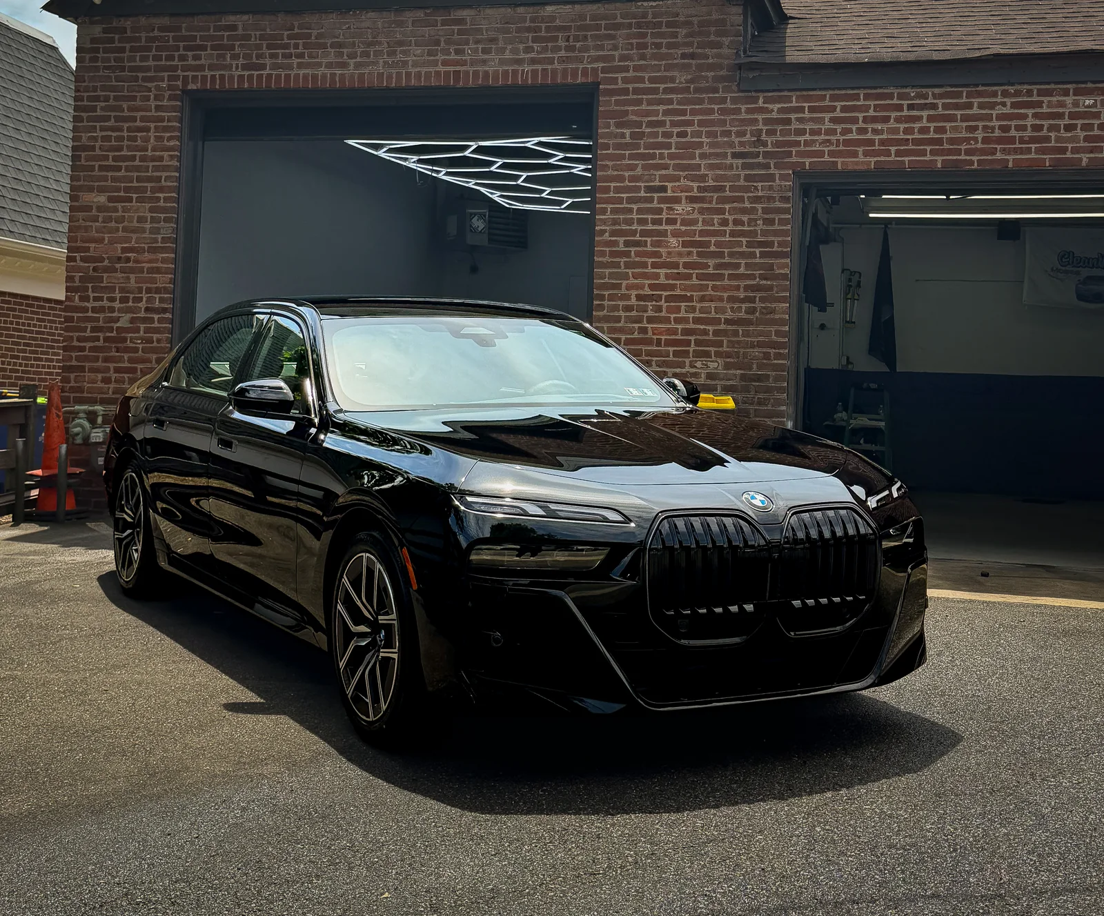 BMW 7 Series in Black Sapphire with mirror paint correction finish at CleanWorx shop