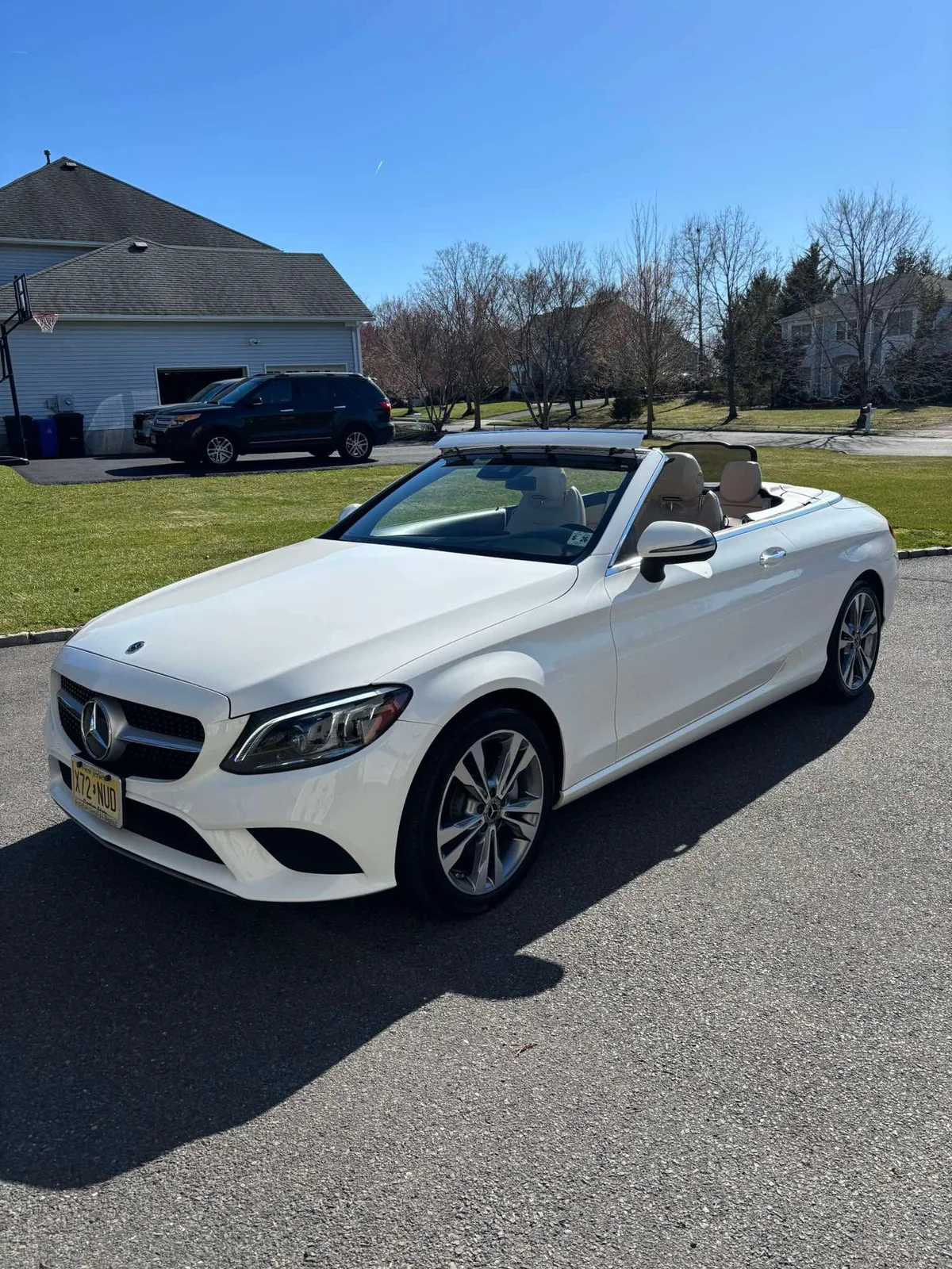 Mercedes-Benz C-Class convertible with top down showing detailed leather interior