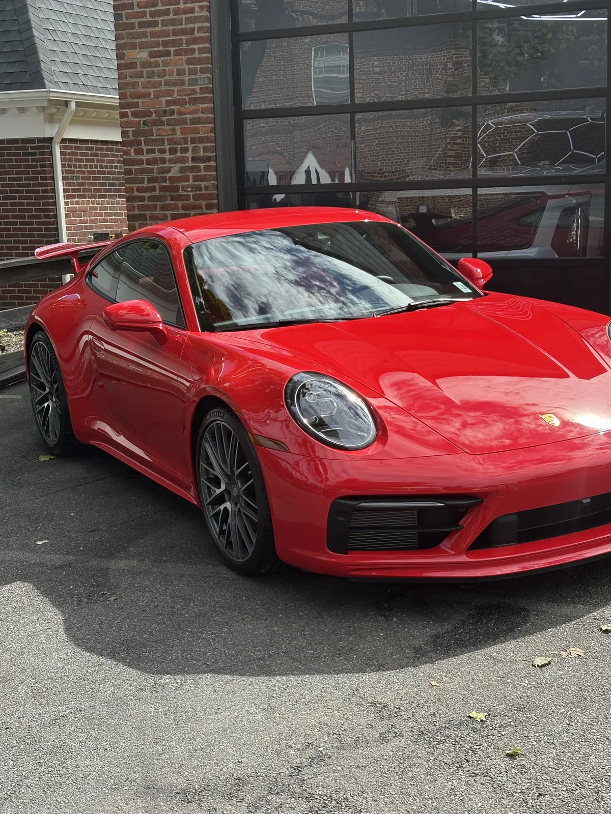 Porsche 911 GT3 in Guards Red with mirror finish paint correction outside CleanWorx shop