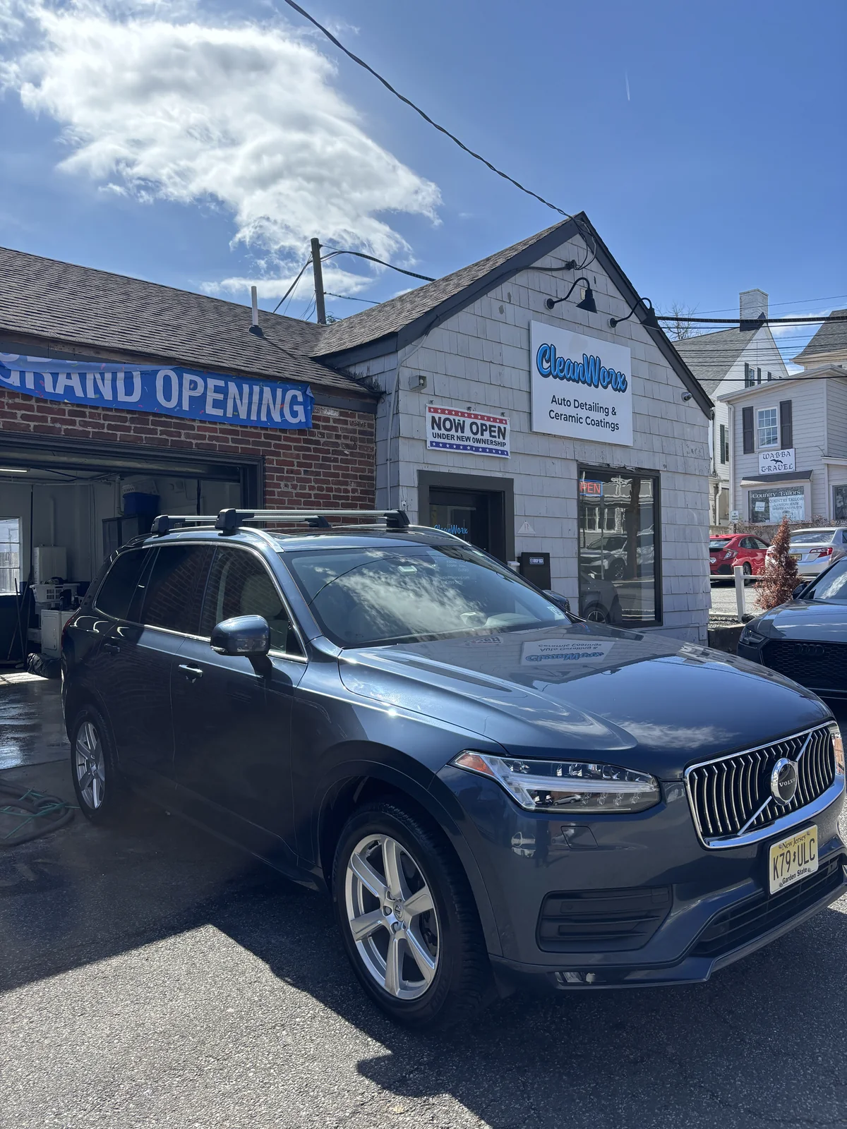 Volvo XC90 luxury SUV detailed outside CleanWorx Grand Opening storefront